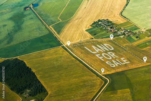 The concept of selling land and residential real estate on the land market is an aerial shot with overlay. visual version. the concept of the real estate market, investment and development. photo