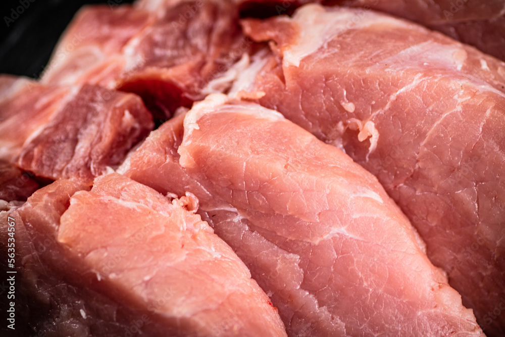 Raw pork. Macro background. The texture of the meat.