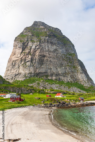 Norwegian coast village by a mountain peak photo