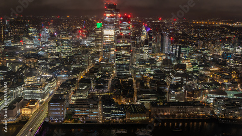 Skyline of London at night from the Shard tower In London, UK on January 2023 © PIKSL