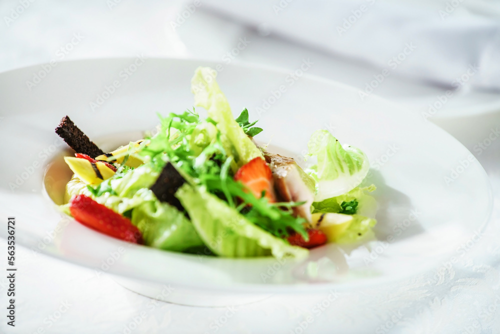 chicken salad with strawberry on the white plate chicken salad with strawberry on the white plate