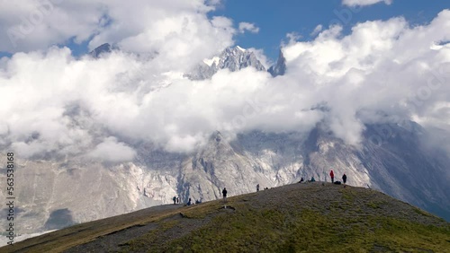 Dramatic Aerial Drone revealing Mont Blanc from the Italian side in Tour du Mont Blanc hike flying in reverse, Alps, Italy