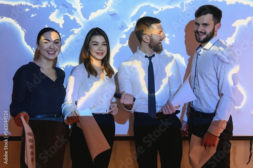 Image of businesspeople standing against world map background