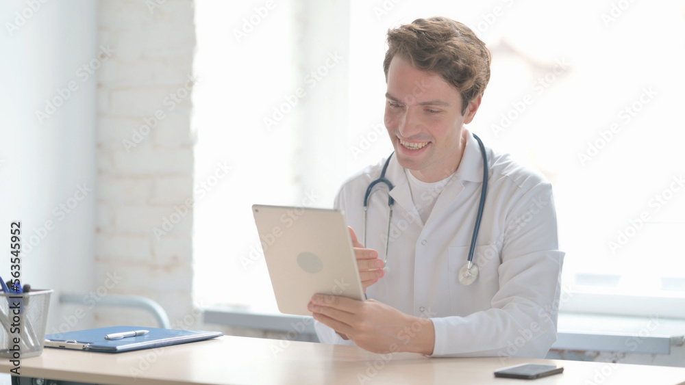 Online Video Call on Tablet by Young Doctor