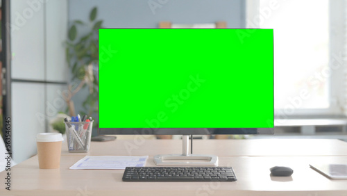 Desktop with Green Screen on Desk in Office