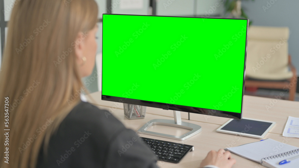 Young Businesswoman using Desktop with Green Screen Young Businesswoman using Desktop with Green Screen