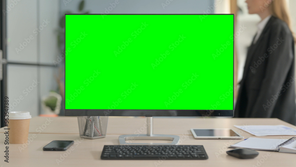 Desktop with Green Screen on Desk in Office Desktop with Green Screen on Desk in Office