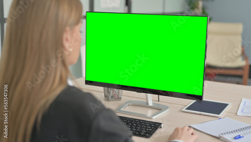 Young Businesswoman using Desktop with Green Screen