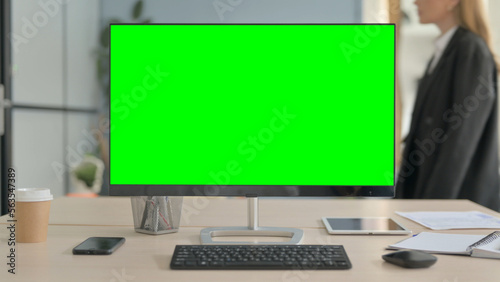 Desktop with Green Screen on Desk in Office