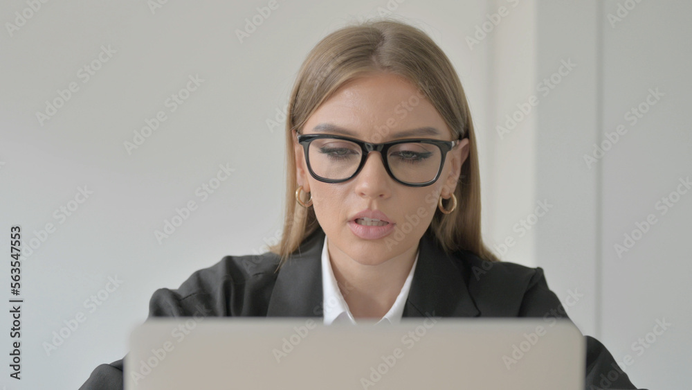 Close Up of Young Businesswoman Talking on Video Call on Laptop Close Up of Young Businesswoman Talking on Video Call on Laptop