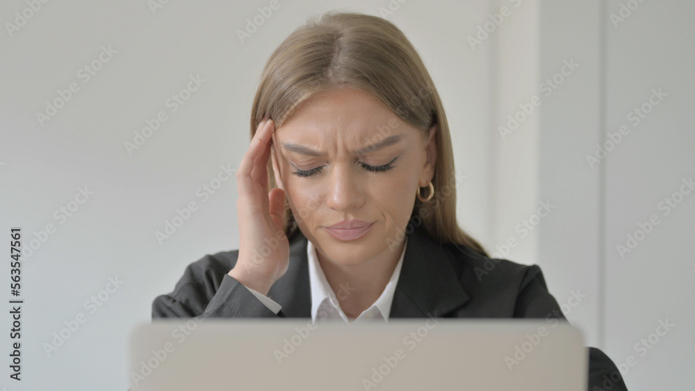 Close Up of Young Businesswoman with Headache Working on Laptop Close Up of Young Businesswoman with Headache Working on Laptop