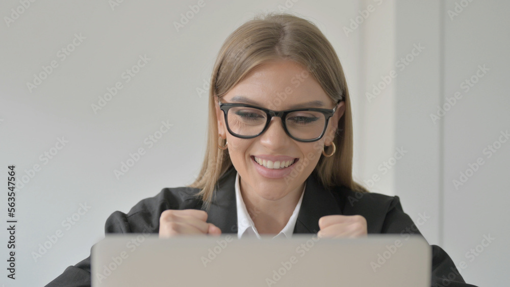 Close Up of Young Businesswoman Celebrating Success on Laptop Close Up of Young Businesswoman Celebrating Success on Laptop