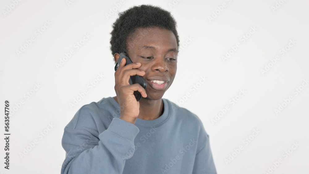 Young African Man Talking on Phone on White Background Young African Man Talking on Phone on White Background
