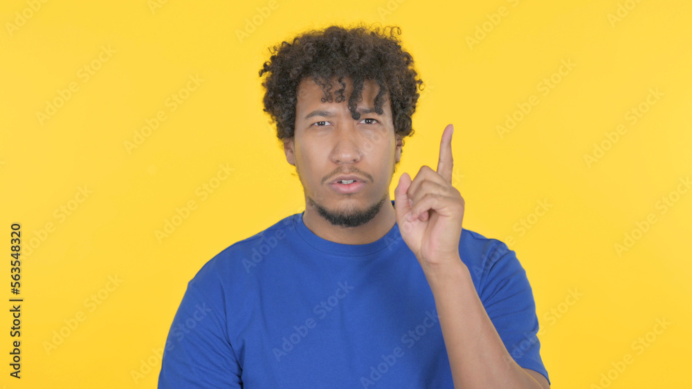 African Man Thinking New Idea on Yellow Background African Man Thinking New Idea on Yellow Background