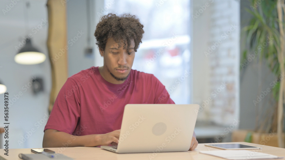 Pensive African Man Working on Laptop Pensive African Man Working on Laptop