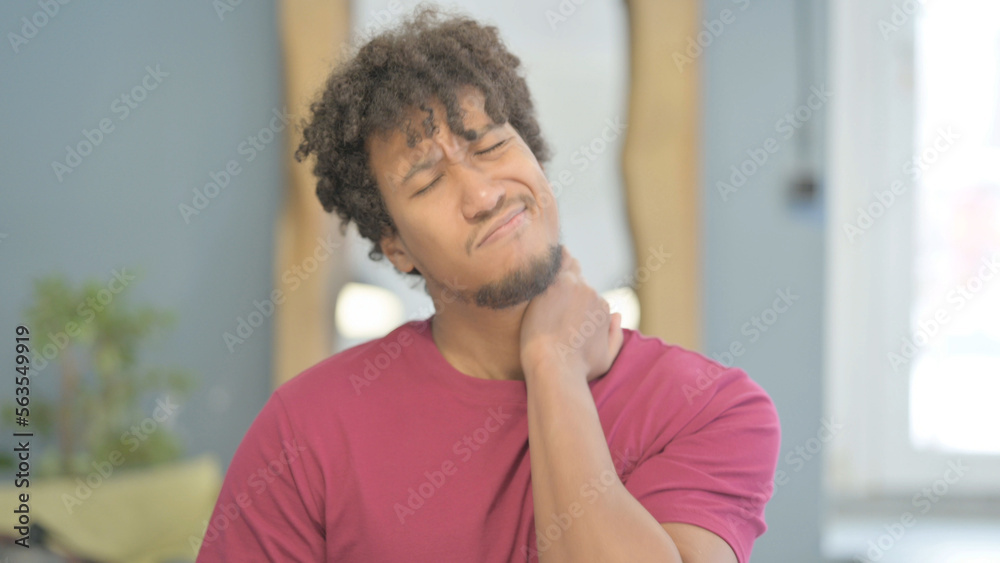 African Man in Pain Massaging His Neck African Man in Pain Massaging His Neck
