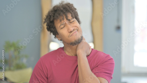 African Man in Pain Massaging His Neck