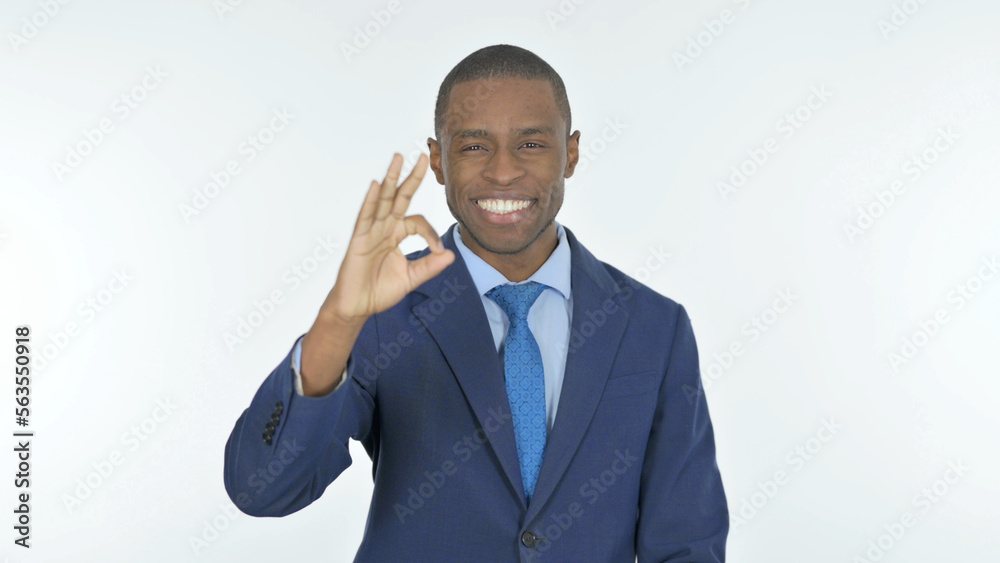 African Businessman with Ok Sign on White Background African Businessman with Ok Sign on White Background