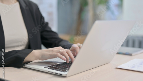 Close up of Businesswoman Typing on Laptop
