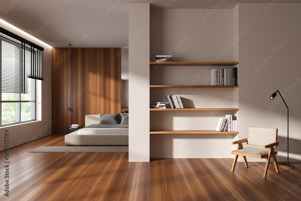 Front view on bright studio room interior with bed, armchair Front view on bright studio room interior with bed, armchair