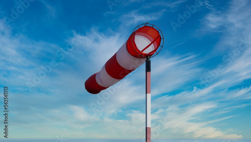 Photos Windsack diagonal wehend mit leicht bewölktem Himmel
