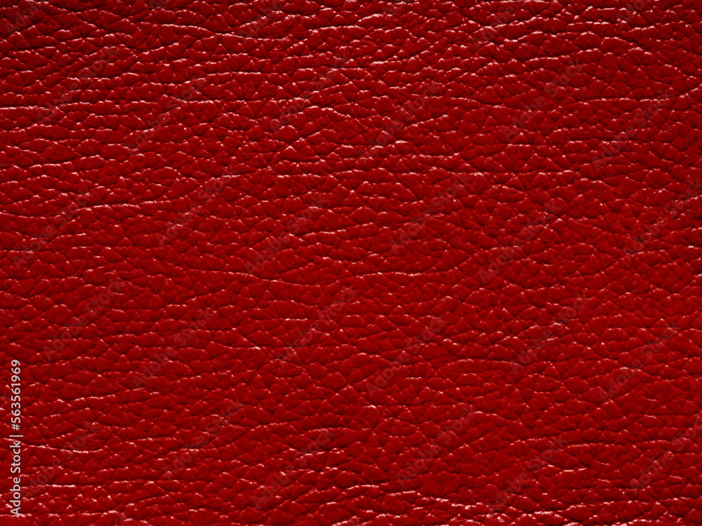 Fototapeta premium Genuine red color leather. Natural material with design lines pattern or red abstract background. Genuine leather texture. Wallpaper for backdrop luxury event, design upholstered furniture, clothing.