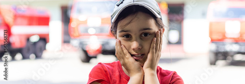 little kid near red fire truck.