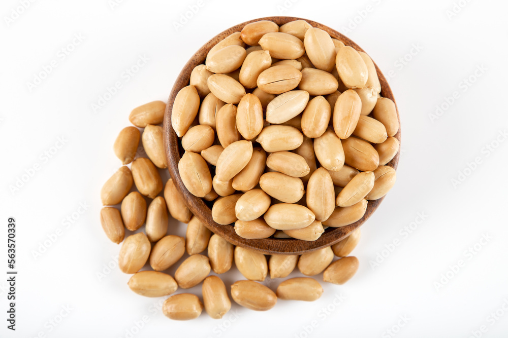 Bowl full of roasted peeled peanuts on white background
Bowl full of roasted peeled peanuts on white background