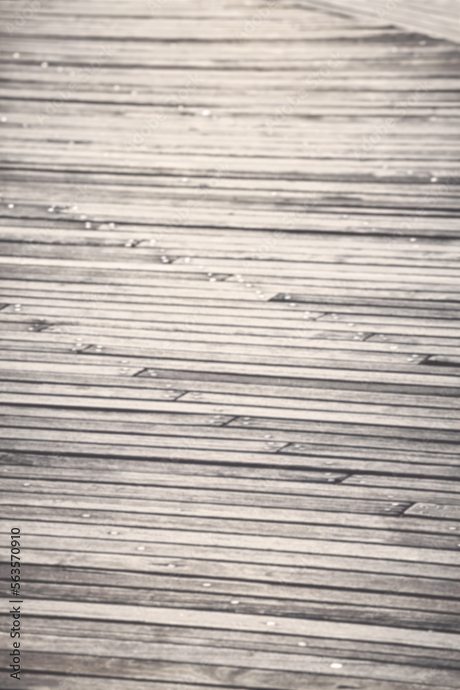 Blurred photo of a wooden boarded floor, abstract background or wallpaper. Blurred photo of a wooden boarded floor, abstract background or wallpaper.
