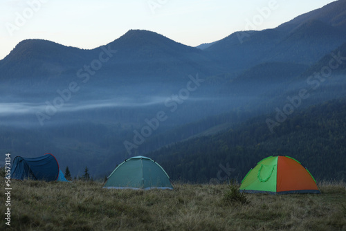 Camping tents in mountains on early morning