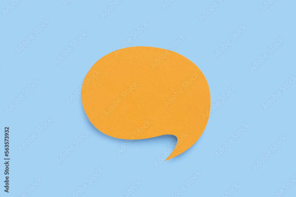 Paper speech bubble on light blue background, top view. Space for text Paper speech bubble on light blue background, top view. Space for text