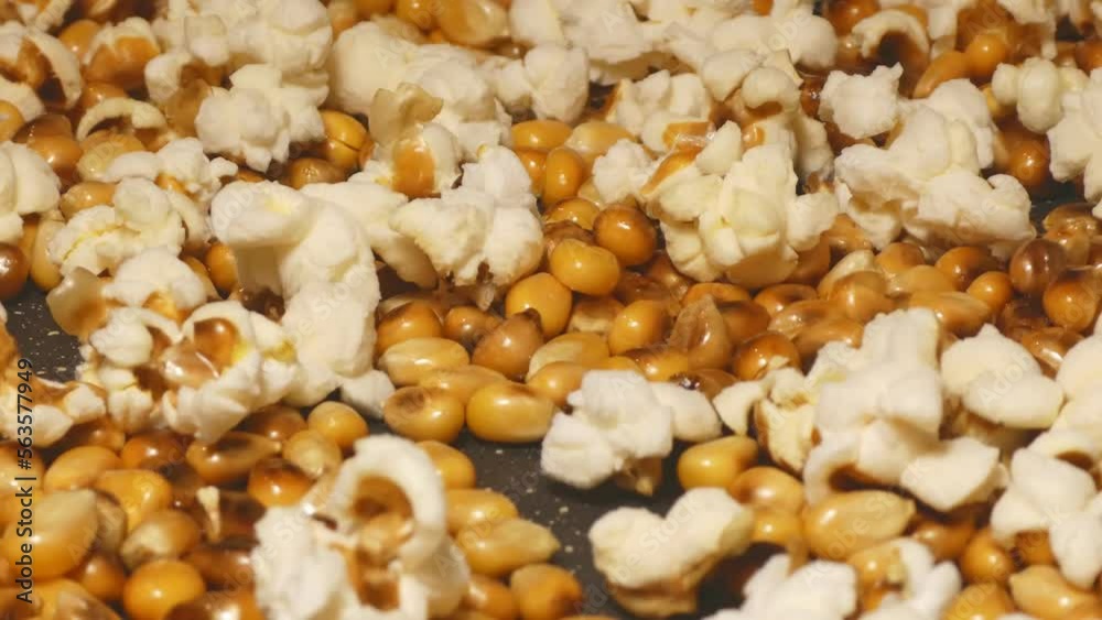 Uncovered home made popcorn popping in frying pan, 4k detail Uncovered home made popcorn popping in frying pan, 4k detail