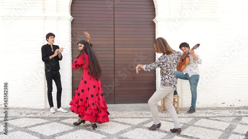 Multiethnic group of flamenco dancers dancing for tourists in San Nicolas. Albaicin.