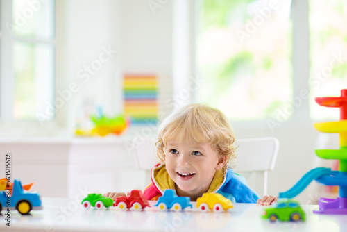 Boy playing toy cars. Kid with toys. Child and car