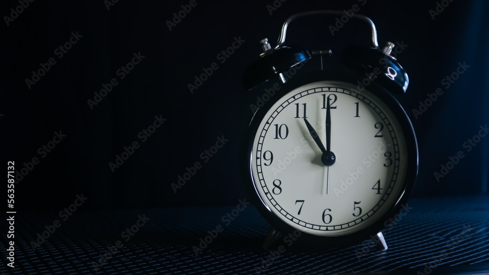 Background photo of an alarm clock showing 11:00 Background photo of an alarm clock showing 11:00