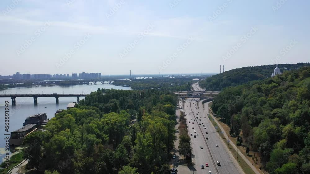 Aerial Drone Flight top down View of freeway busy city rush hour heavy traffic jam highway. Aerial view of the vehicular intersection, traffic at peak hour with cars on the road, on the bridge. Aerial Drone Flight top down View of freeway busy city rush hour heavy traffic jam highway. Aerial view of the vehicular intersection, traffic at peak hour with cars on the road, on the bridge.