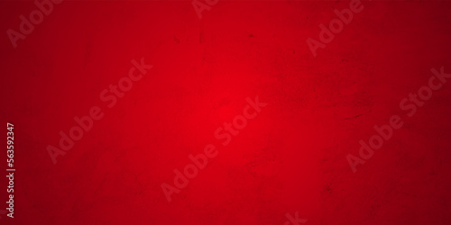 Red grunge textured wall background. Texture of red decorative plaster or concrete with vignette. Abstract grunge background for design.