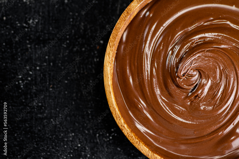 Hazelnut butter in a wooden plate. Hazelnut butter in a wooden plate.