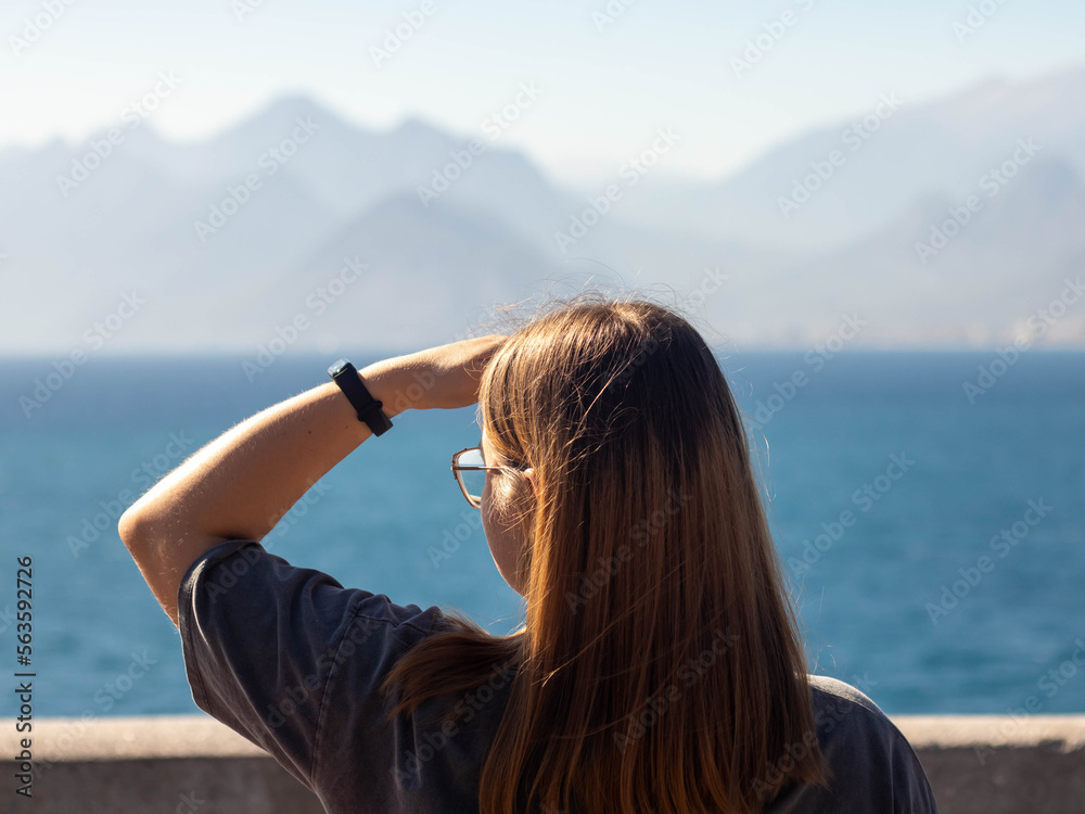 A girl looking on the sea