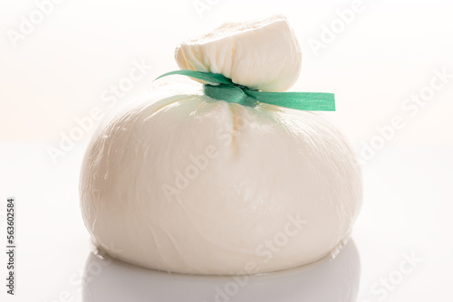 Burrata - Italian cheese, which is an excellent combination of mozzarella and cream on white background
