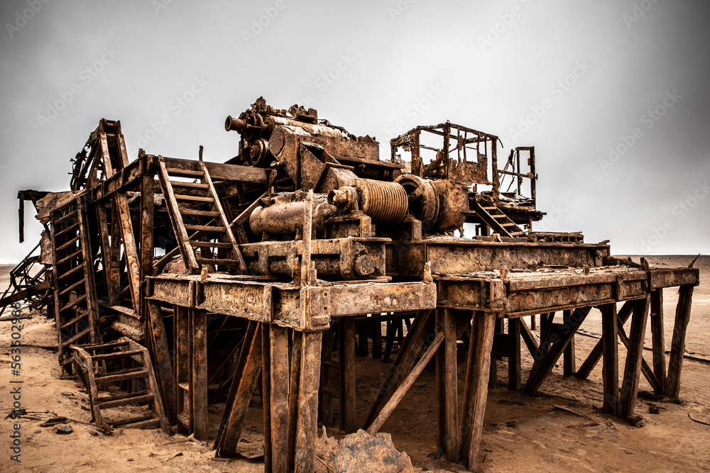 The rusted remains of an abandoned oil drilling rig between Henties Bay and Torra Bay, Skeleton Coast, Namibia. The rusted remains of an abandoned oil drilling rig between Henties Bay and Torra Bay, Skeleton Coast, Namibia.