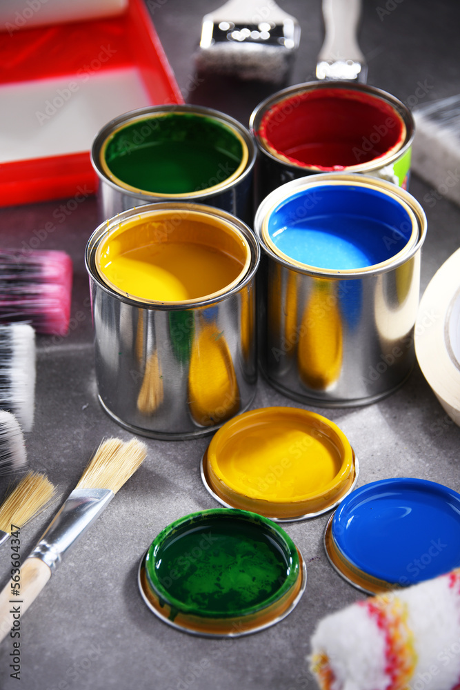 Paintbrushes of different size and paint cans Paintbrushes of different size and paint cans