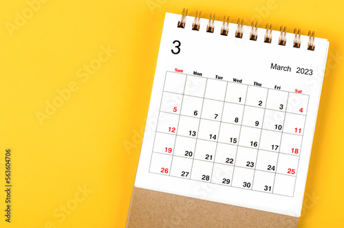 The March 2023 Monthly desk calendar for 2023 year on yellow background.