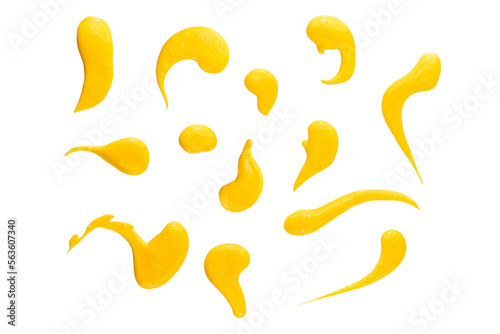 Set of yellow drops and splashes of cheese sauce or mustard isolated on white background. With clipping path. Full depth of field. Focus stacking
