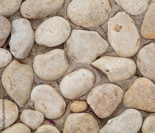 Stones in a concrete wall as an abstract background.