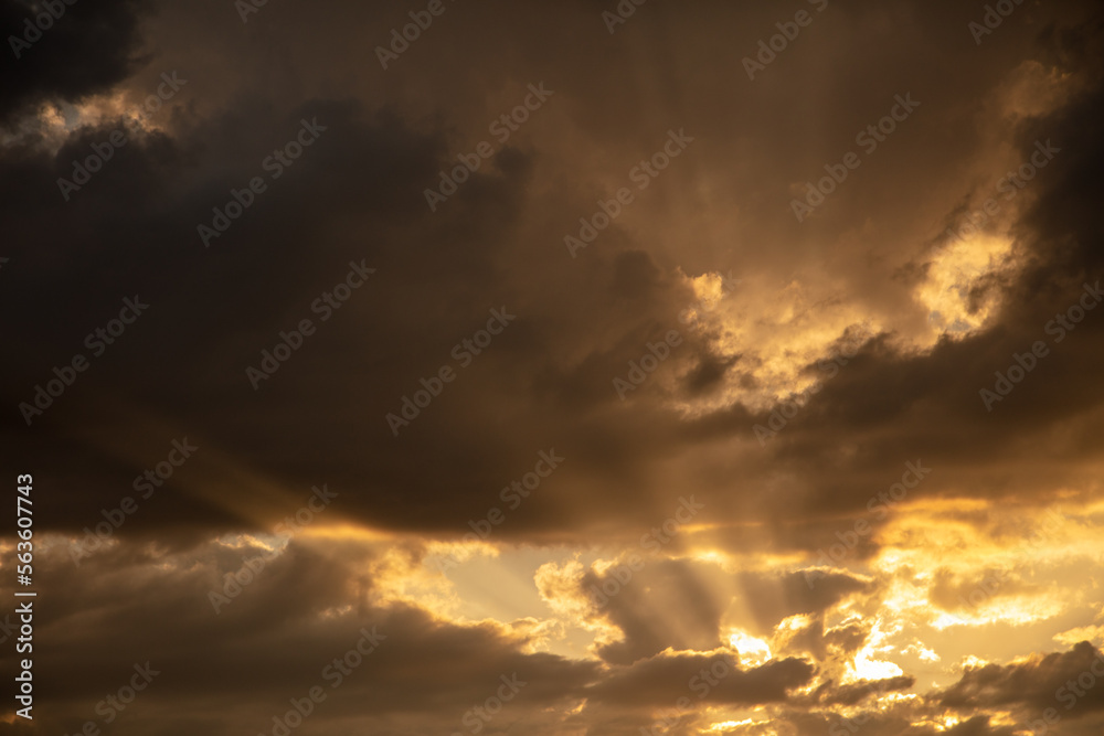 Fototapeta premium Thunderclouds in the sky at sunset.