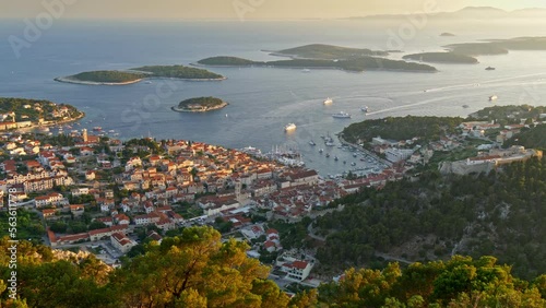 Aerial view of Hvar city, Croatia. Hvar island during sunset. Panoramic shot of the island city and Yachts sailing the Adriatic sea. UHD photo
