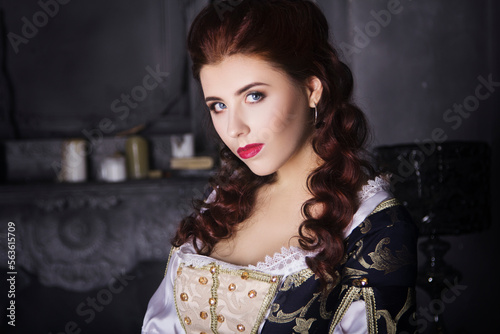 Photos Beautiful woman in an old dress with a train