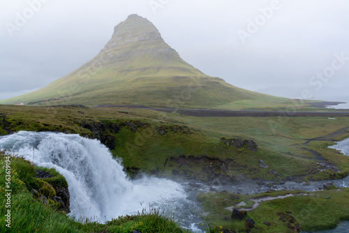 Kirkjufell in Iceland the fog with waterfall in front