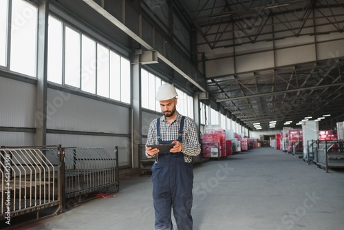 young worker in warehouse background